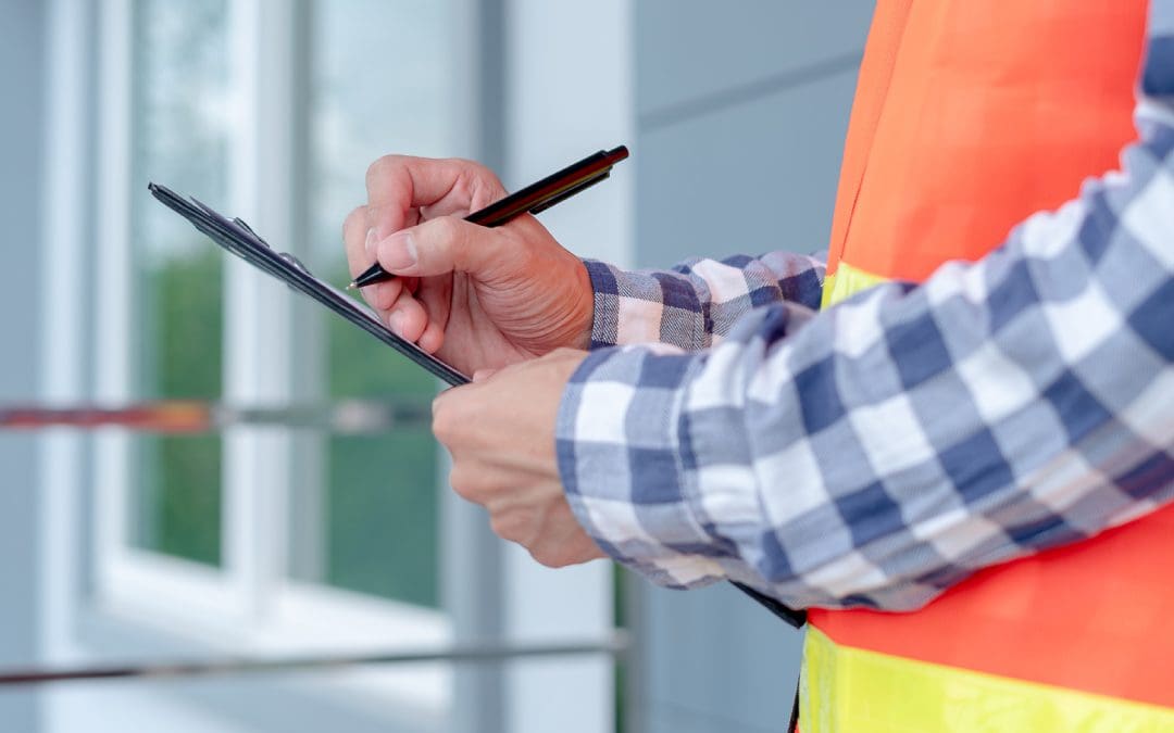 A person with a clipboard checking a list