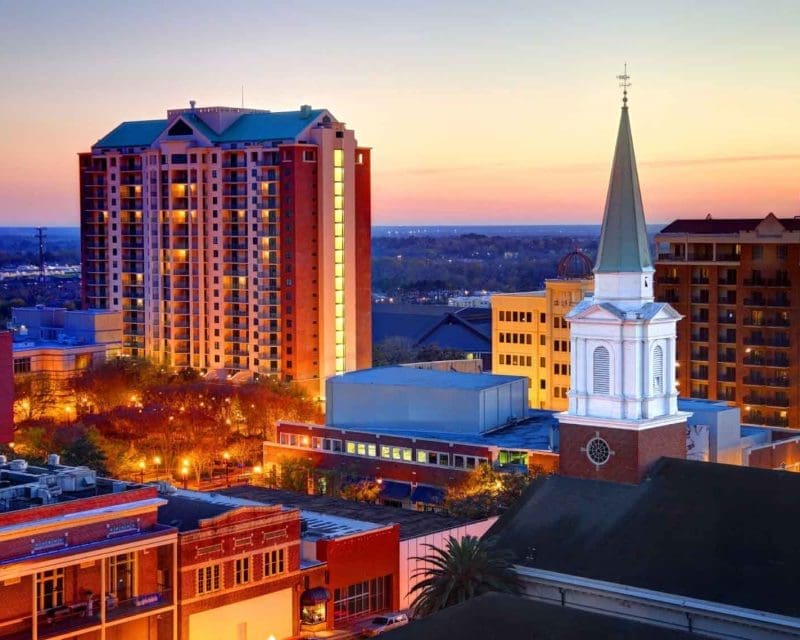 Tallahassee at sunset - including a high rise apartment building and a church downtown