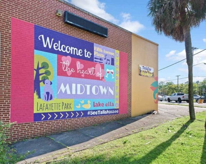 A mural on the side of a brick building for Midtown; a neighborhood in Tallahassee